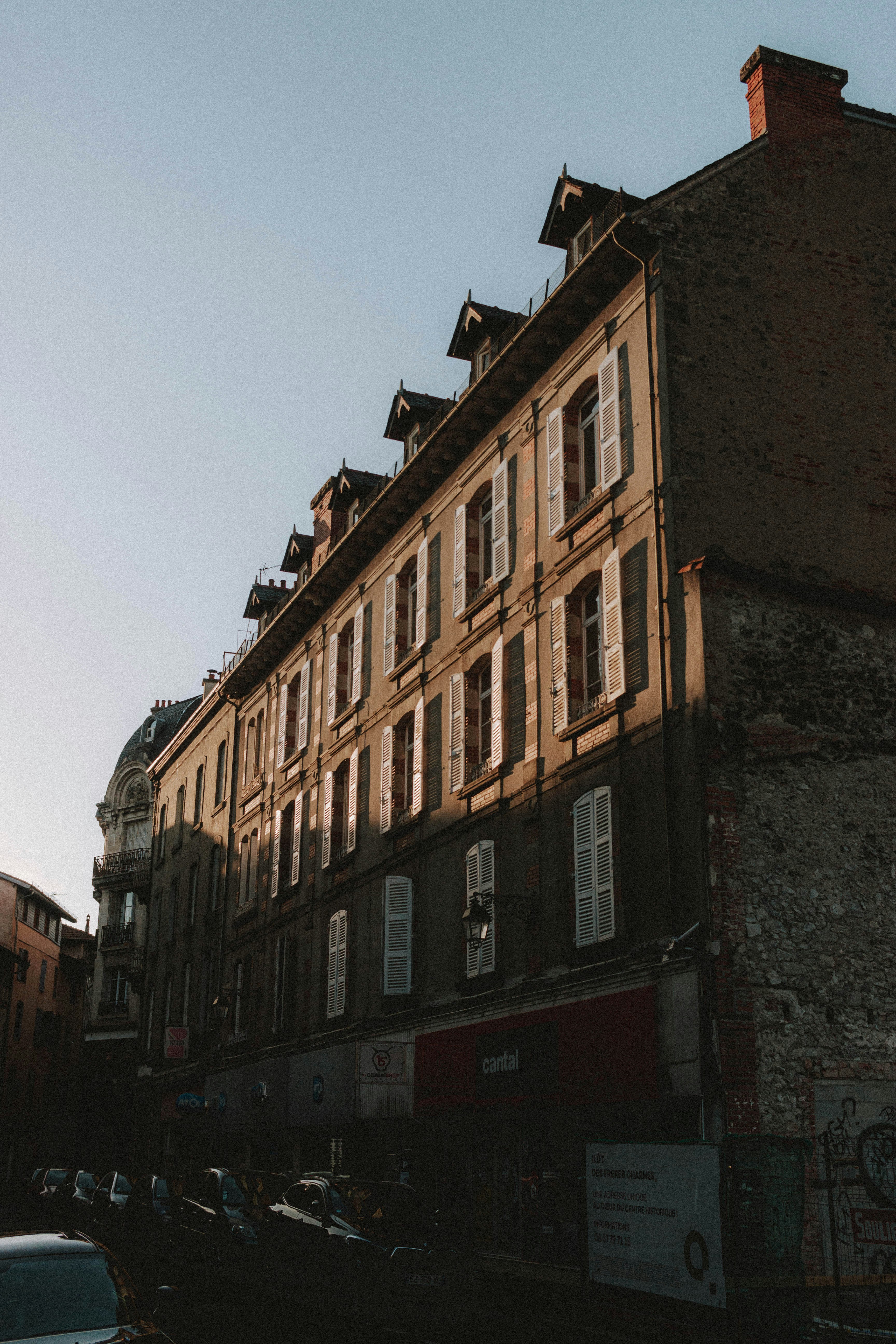 brown concrete building under blue sky during daytime